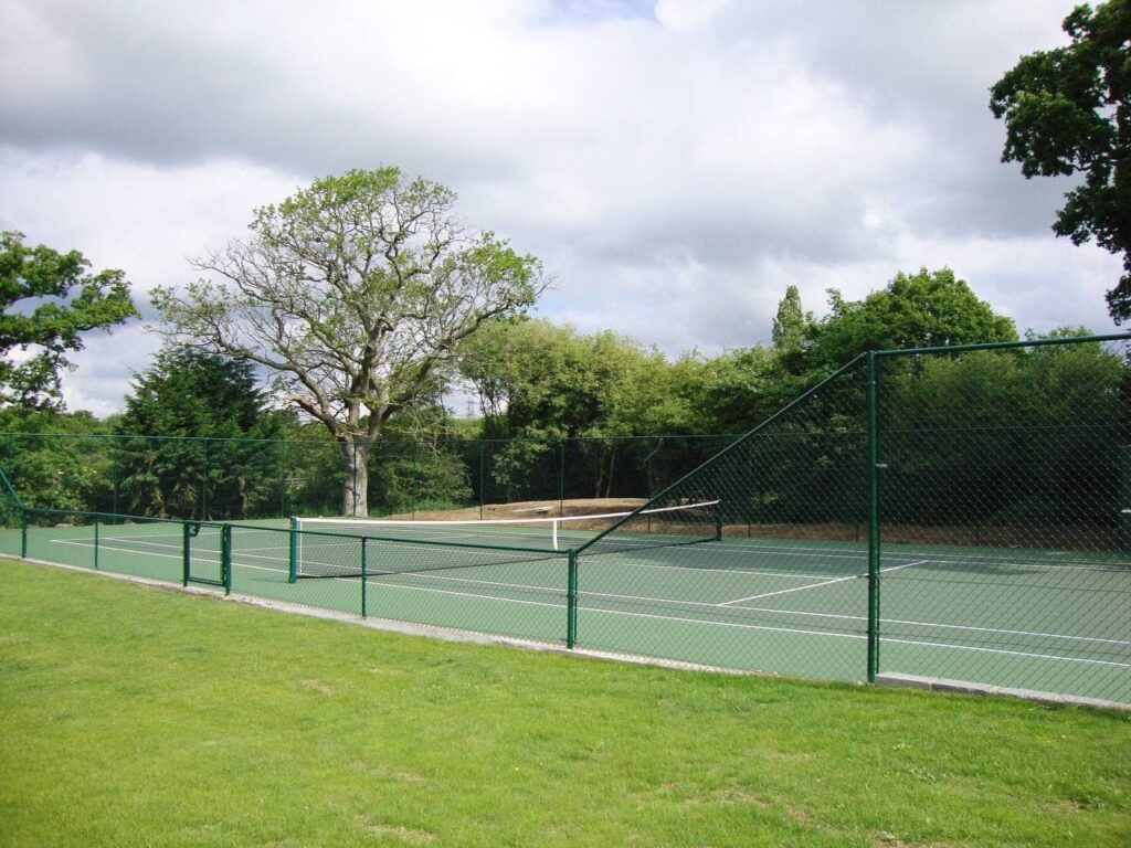This is a photo of a new tennis court installed in Wiltshire, All works carried out by Tennis Court Construction Wiltshire