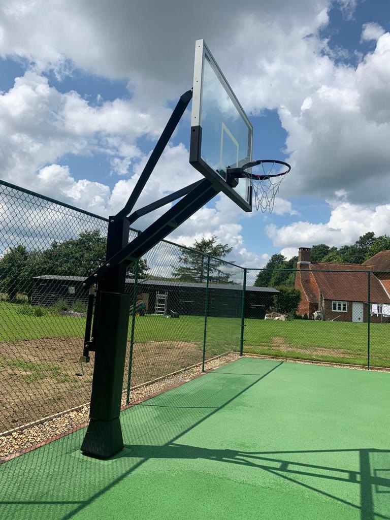 This is a photo of a new tennis court installed in Wiltshire, All works carried out by Tennis Court Construction Wiltshire