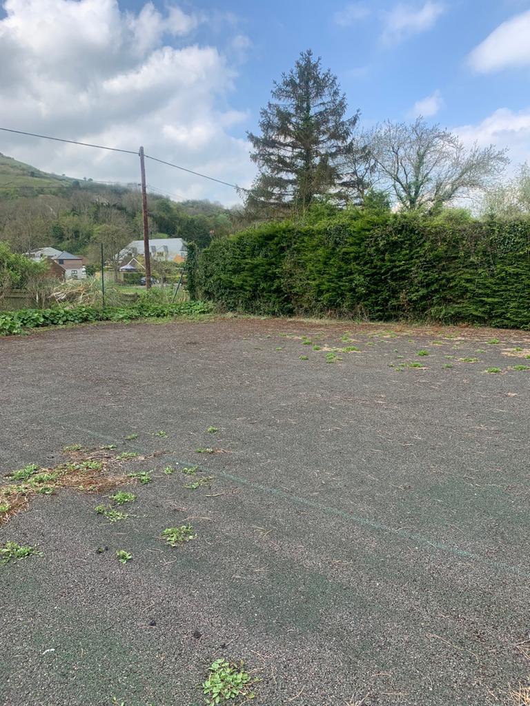 This is a photo of a tennis court in Wiltshire that is in need of refurbishment