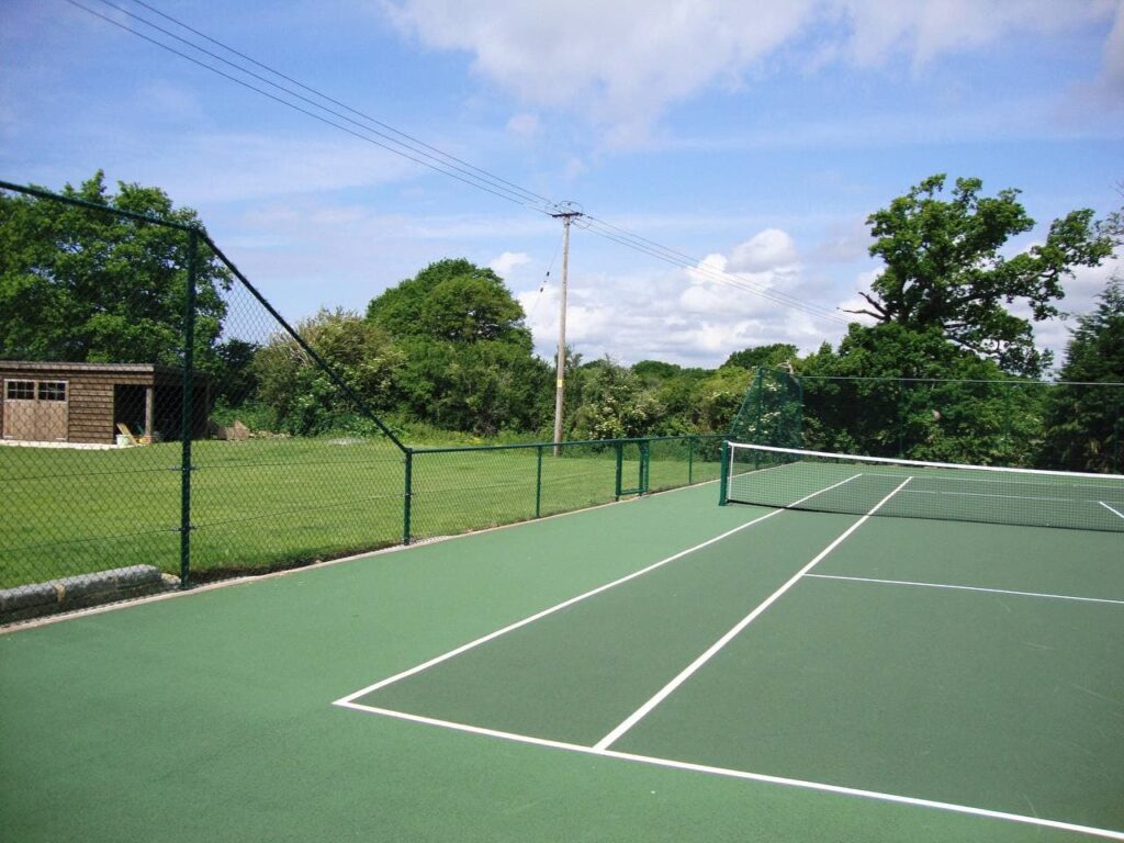 This is a photo of a new tennis court installed in Wiltshire, All works carried out by Tennis Court Construction Wiltshire